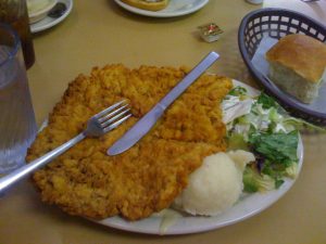 BIG chicken fried steak with the gravy underneathe.
