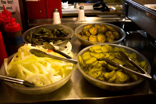 A traditional BBQ dinner is not complete without pickles and onions.