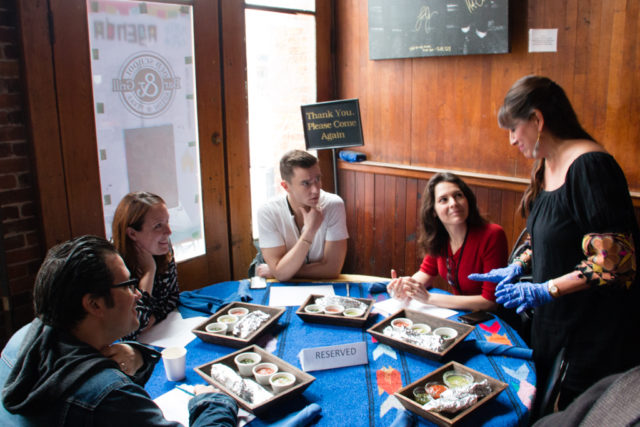 Diana Teviño serving the taco judges. Photo by Matthew Niemann.